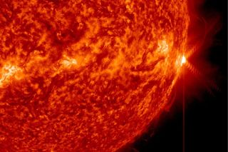 An X1.3-class solar flare (far right) erupts from the surface of the sun on April 24, 2014 EDT (April 25 GMT).