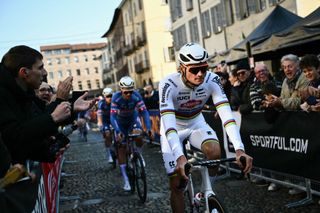 van der Alpecin-Deceuninck's Dutch rider Mathieu Van der Poel (R) rides prior to the start of the 115th Milan-SanRemo one-day classic cycling race, in Pavia, on March 16, 2024. (Photo by Marco BERTORELLO / AFP)