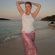 Sabina Socol wearing a white tank top