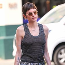 Emma Corrin wears a tank top in Portofino