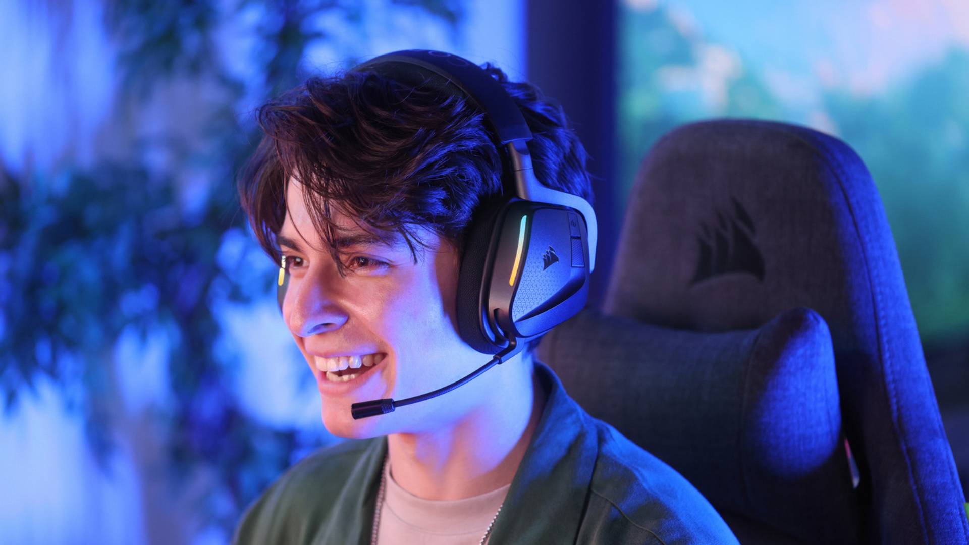 Official promo image of a person wearing a black headset with its microphone attached, looking to the left side of the frame.