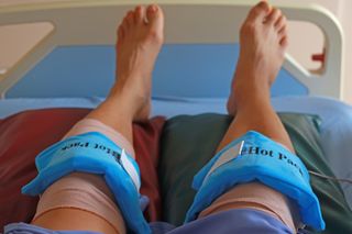 Two knees with hot packs