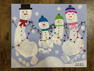 Snowmen Christmas card made from white footprints