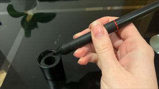 XPPen Artist 15.6 Pro stylus being held