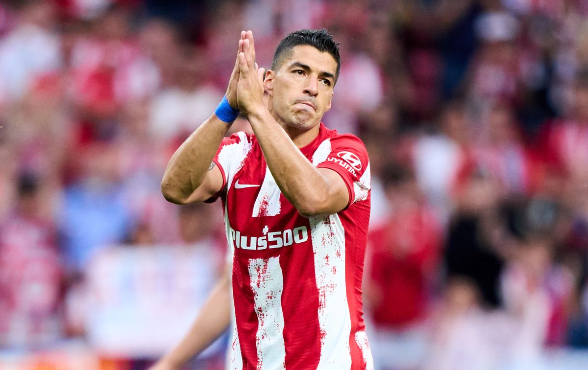 Luis Suarez applauds the Atletico Madrid supporters