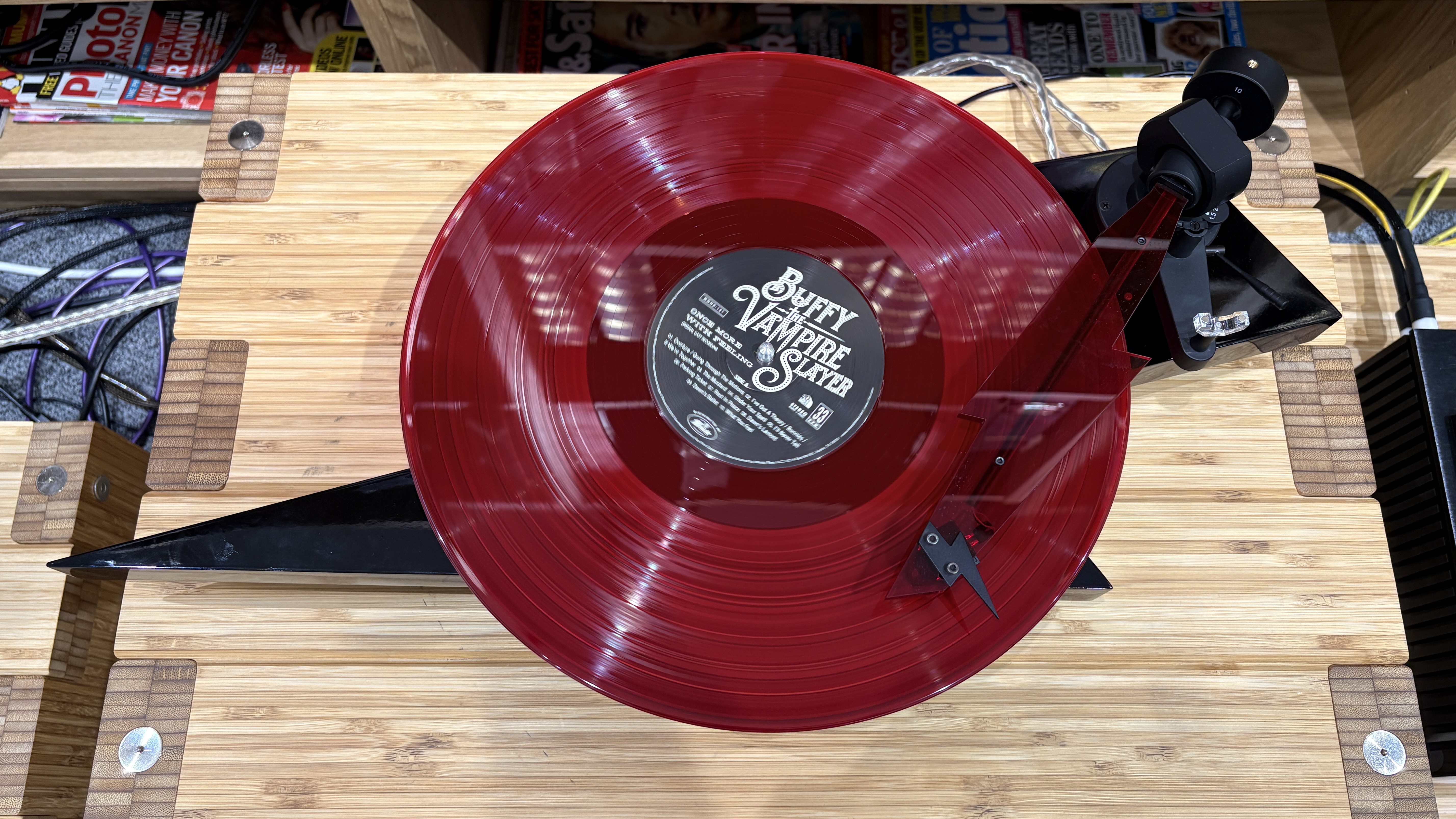 Pro-Ject AC/DC Turntable on wooden hi-fi rack