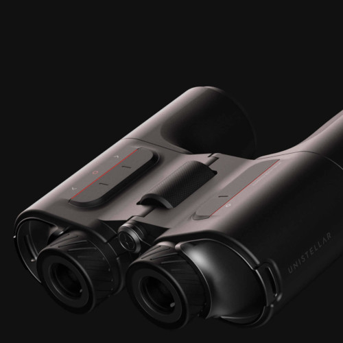 A pair of Unistellar Envision smart binoculars on a black background. 