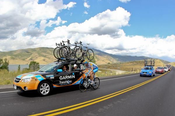 A Holowesko rider has a chat at the team car.