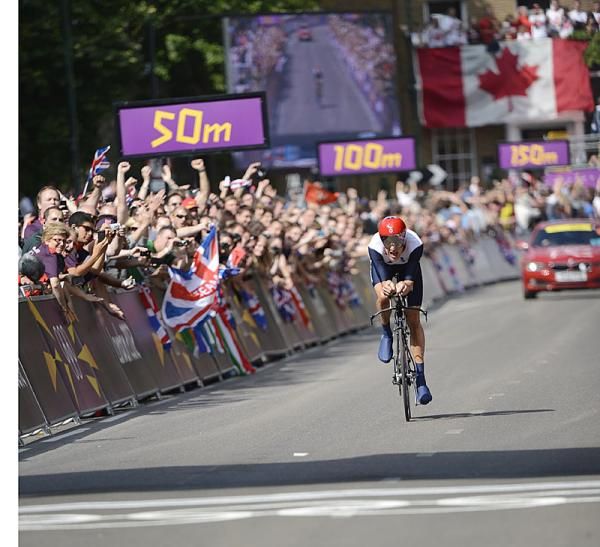 Bradley Wiggins (Great Britain) is cheered by the crowds