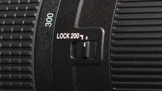 Image shows a closeup sideview of the Nikkor AF-S 200-500mm f/5.6E ED VR lens