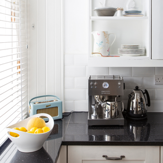 White cabinetry, black worktops. Drinks station. Bespoke Kitchens.