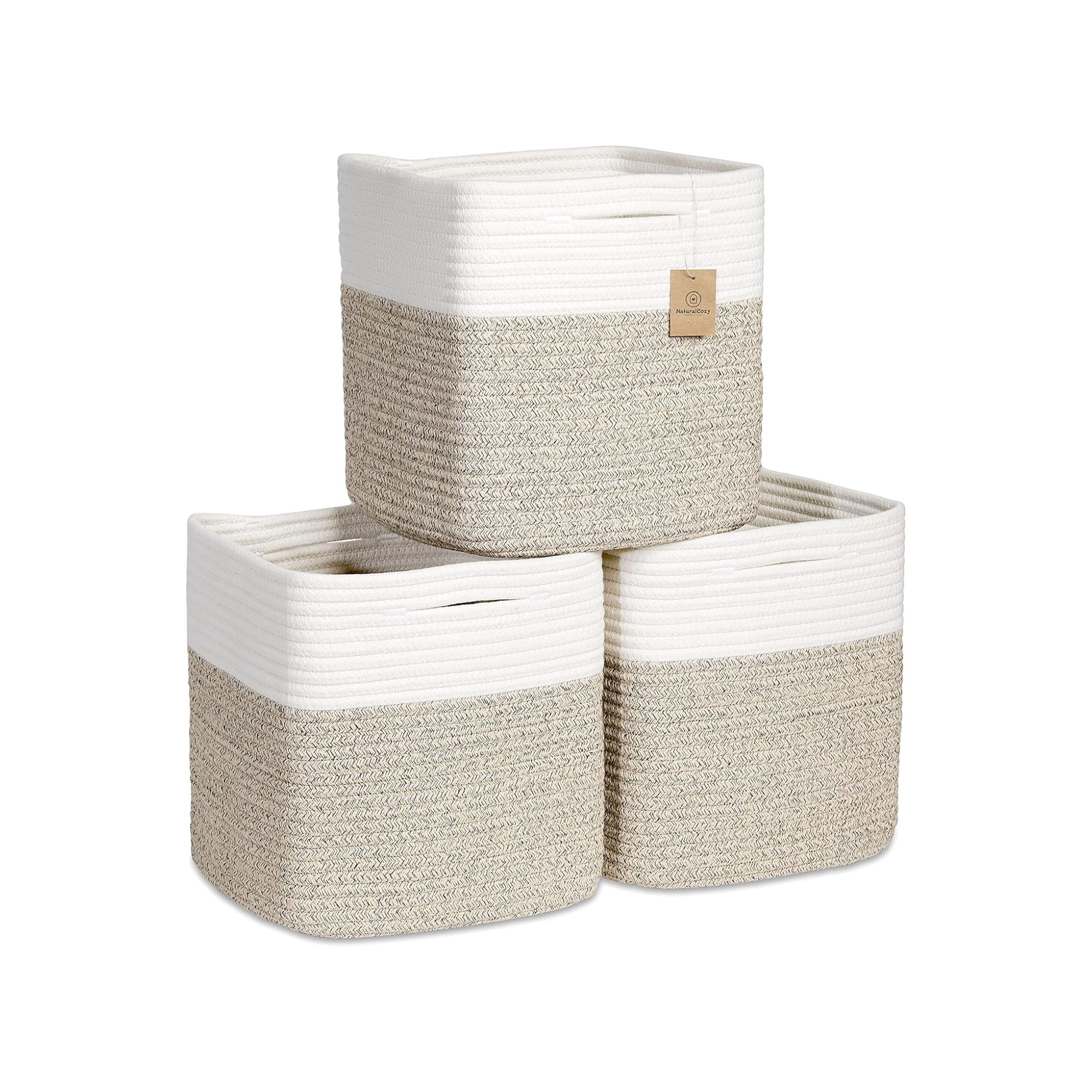 Three white and brown knitted storage cubes