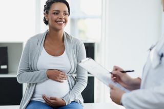 Pregnant woman having a consultation in hospital