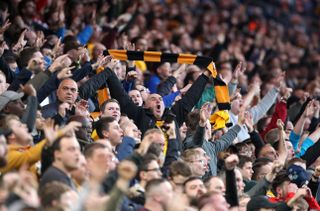 Wolverhampton Wanderers fans celebrate in the stands during a Premier League match