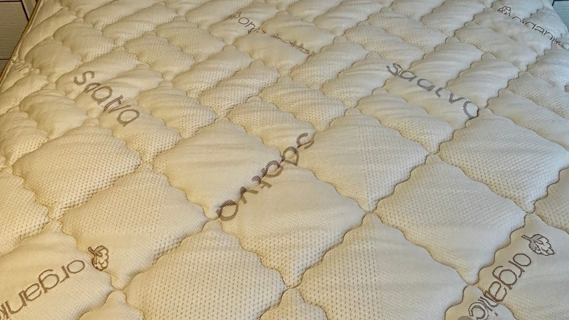 The image shows the Saatva Solaire Adjustable Firmness Mattress set up in our tester&#039;s home