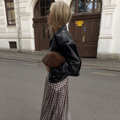 @emelieolson wears gingham skirt leather jacket