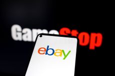 Ryan Cohen's Gamestop logo behind an eBay logo on a phone screen