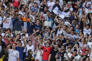 Hazard takes a snapshot with his phone in front of 50,000 Real Madrid fans at the Bernabeu