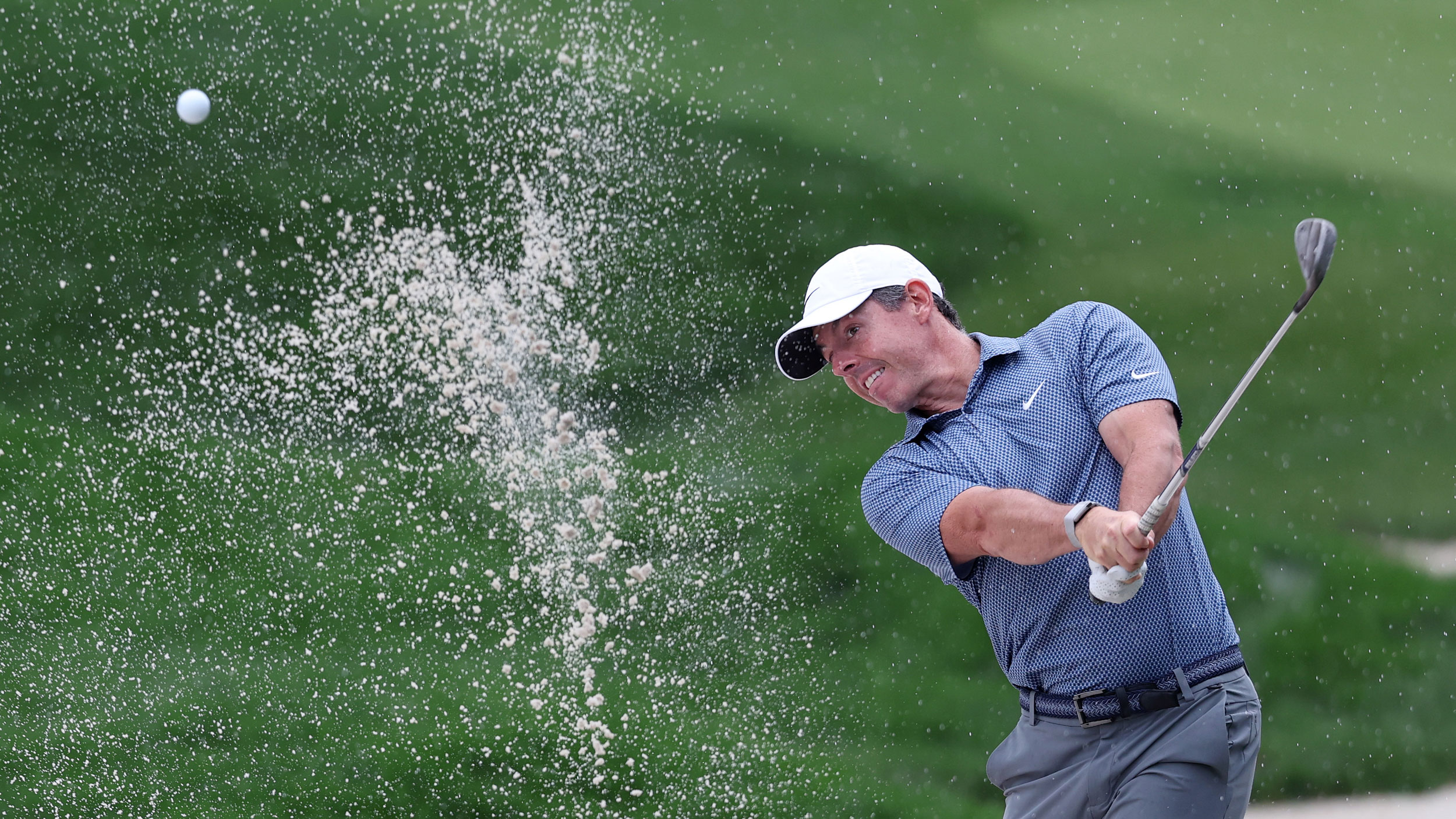 Rory McIlroy hitting a bunker shot