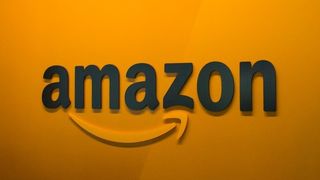 Amazon logo on an orange wall