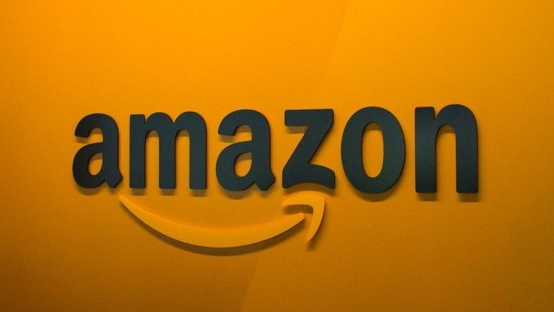 Amazon logo on an orange wall