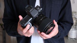 Fujifilm GFX 100 II camera in a hand