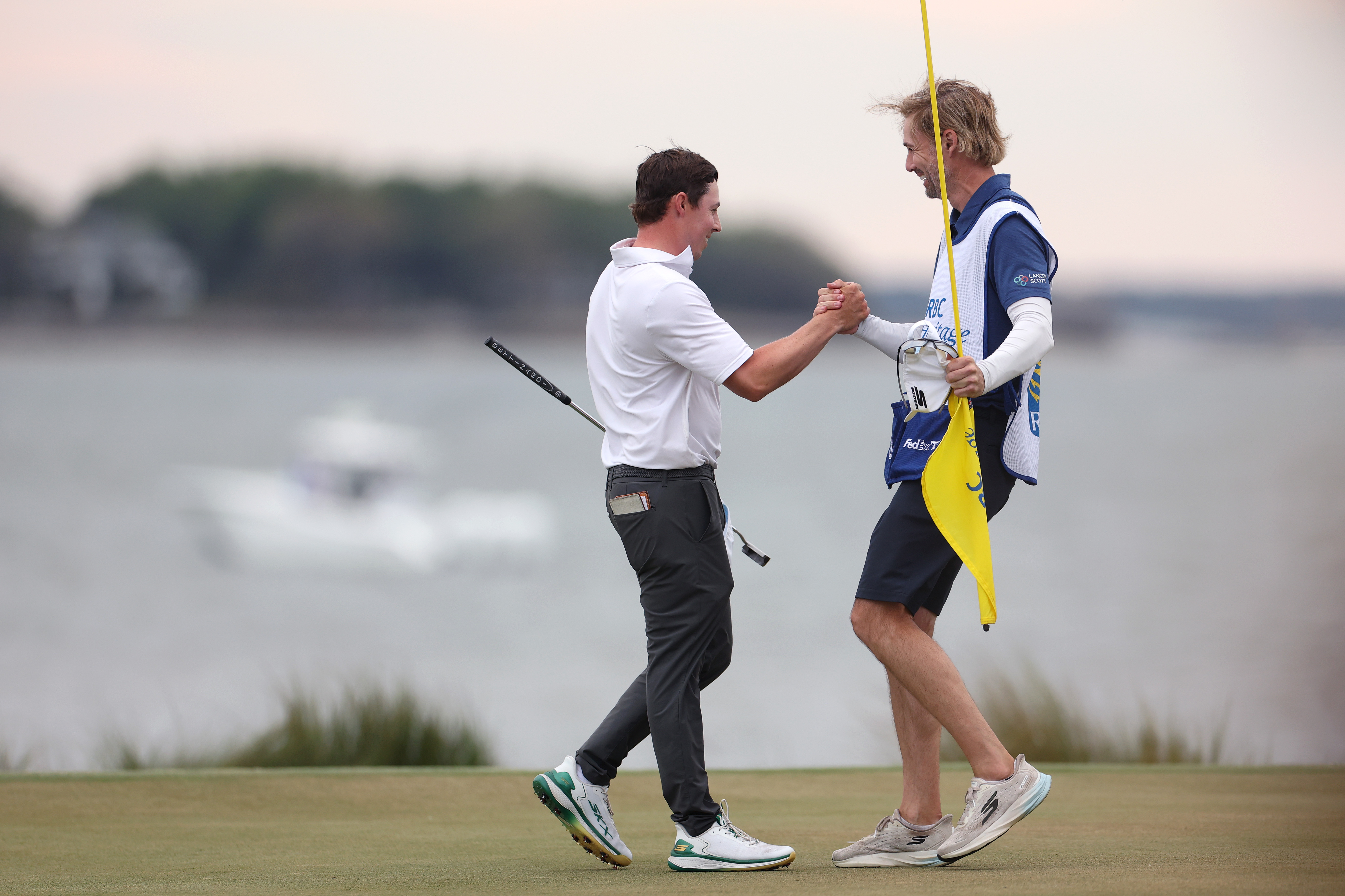 Matthew Fitzpatrick and caddie Daniel Parratt celebrate after winning the RBC Heritage