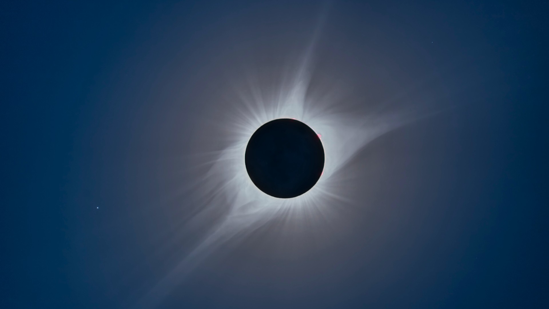 A composite of the August 21, 2017 total solar eclipse. The bright star at left is Regulus.