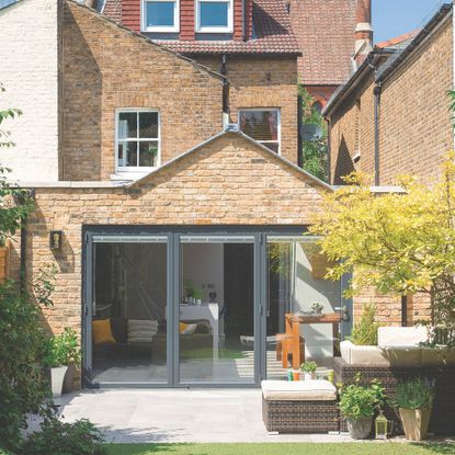 Garden area of a semi-detached house with a modern extension