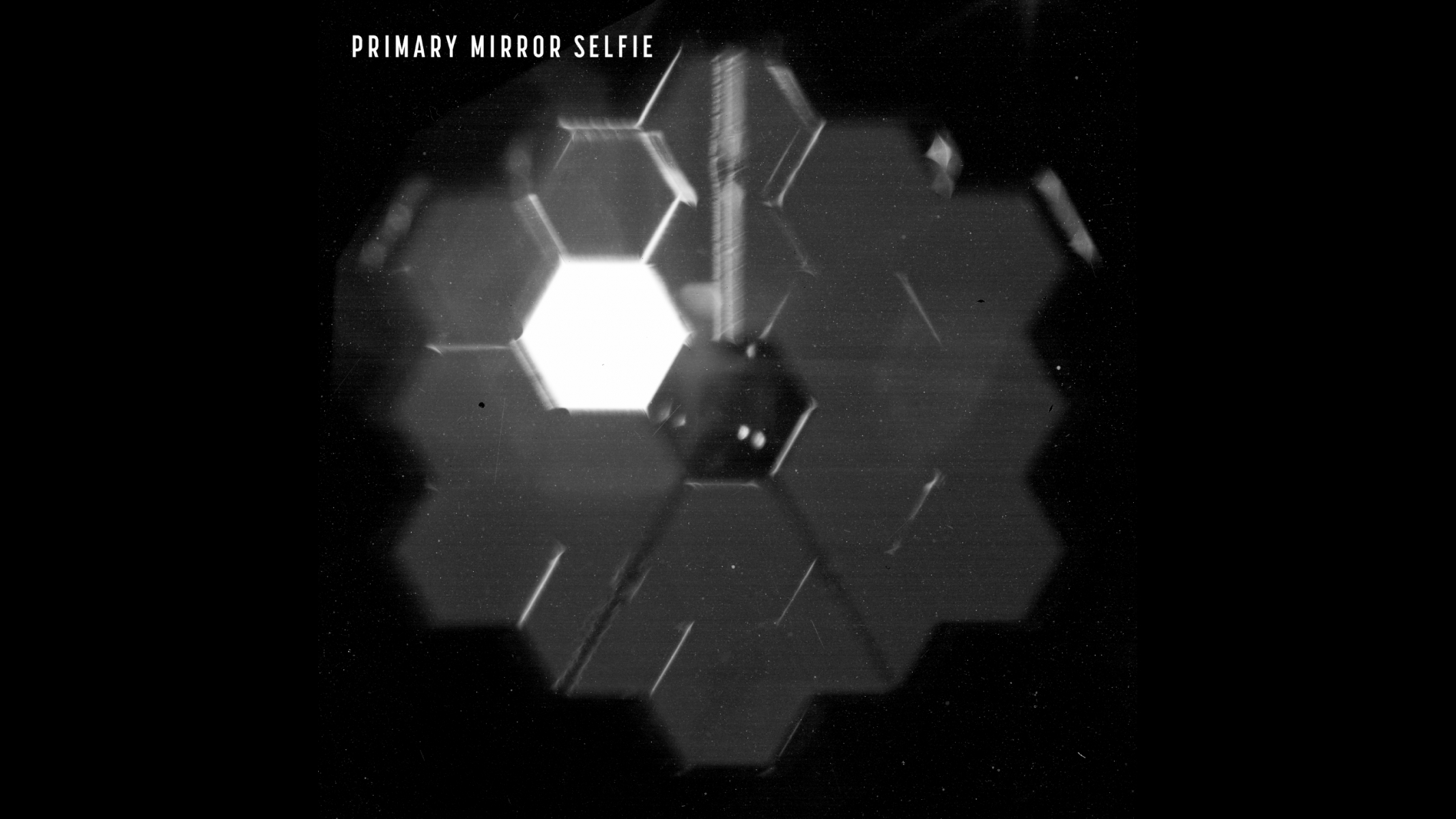 A "selfie" shows the 18 segments of the James Webb Space Telescope's primary mirror as seen from a specialized camera inside the NIRCam instrument.