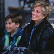 Princess Diana rides a sled with Prince William and Prince Harry