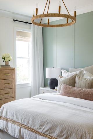 bedroom with sage accent wall