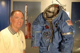 Former MOL astronaut Robert Crippen poses with a Manned Orbiting Laboratory spacesuit discovered in a closet in the Air Force Space and Missile Museum in Cape Canaveral in 2005. The spacesuit, designed for MOL astronaut Richard Lawyer, was used in the Gemini-B crew transfer hatch tests in 1966 and remained stored in obscurity for almost 40 years.
