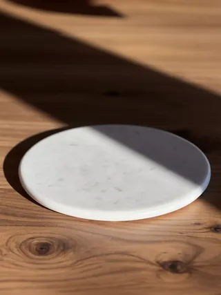 marble cheeseboard on a wooden table.