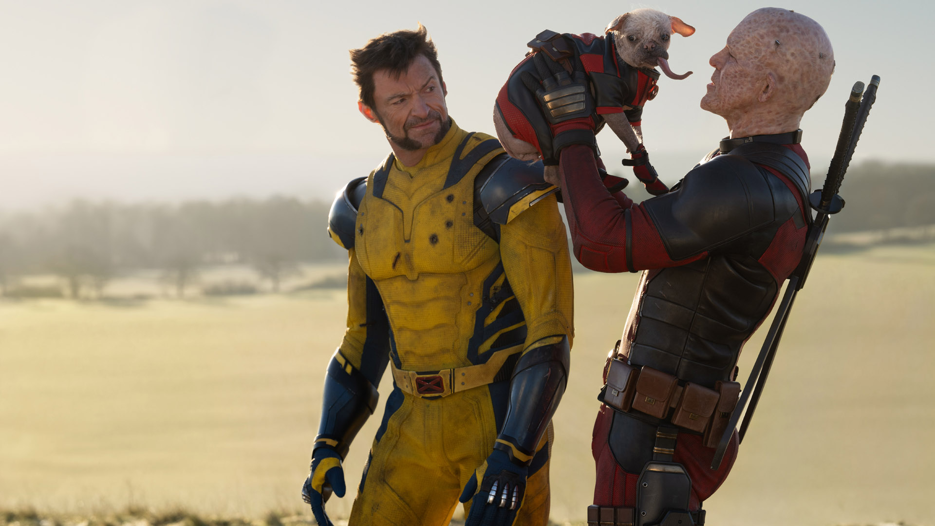 Wolverine watches Dogpool try and lick Deadpool's face in Deadpool 3