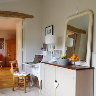 home office with wooden beam and olivia mirror