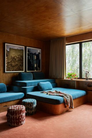 a media room with bright blue deep and casual bespoke sofa