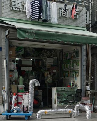 Hardware shop with silver tubes out front