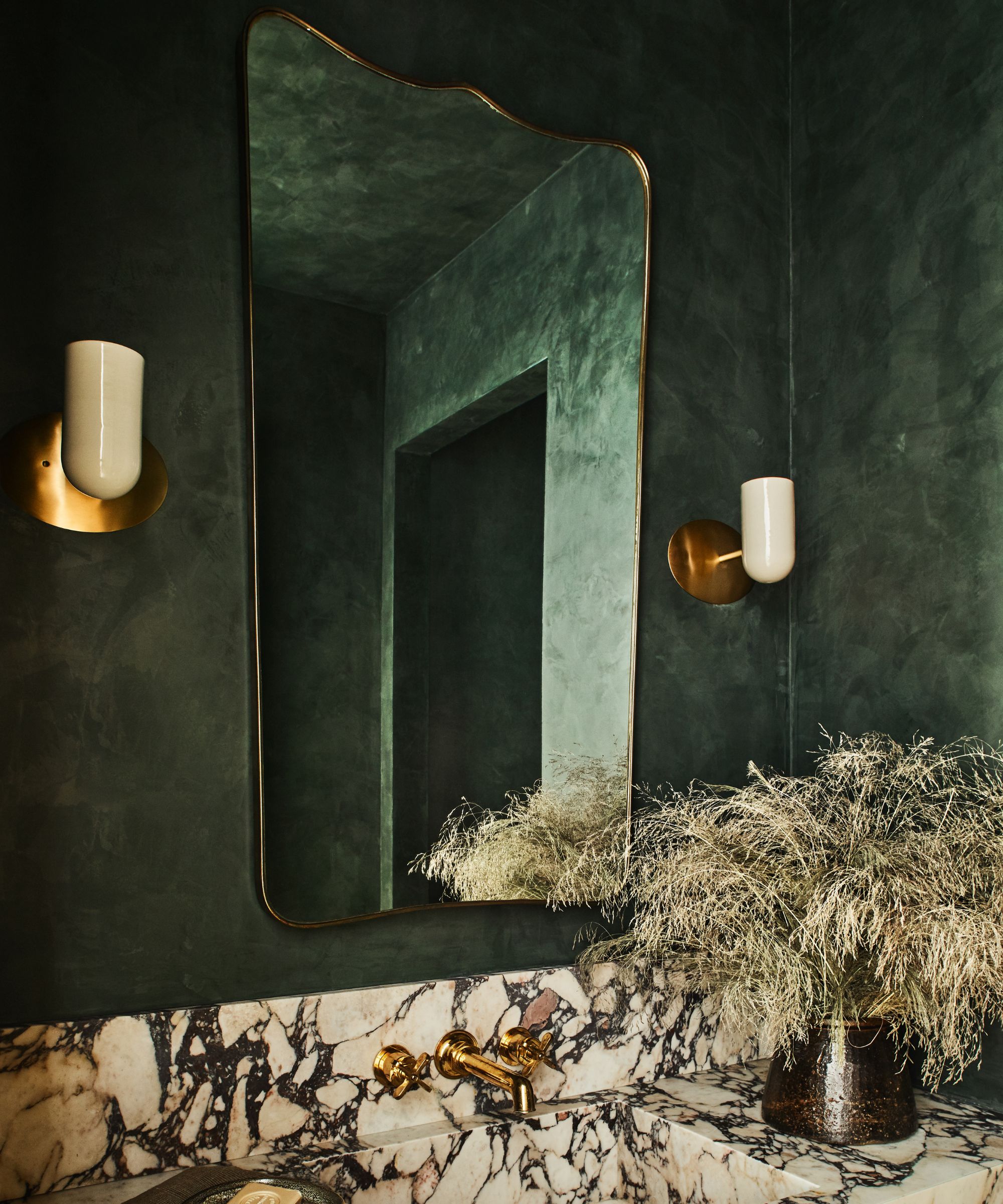 green bathroom with marble counter