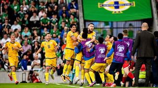 Abat Aimbetov of Kazakhstan celebrates after scoring his side's first goal during the UEFA EURO 2024 Championship Qualifier match between Northern Ireland and Kazakhstan at National Stadium at Windsor Park in Belfast.