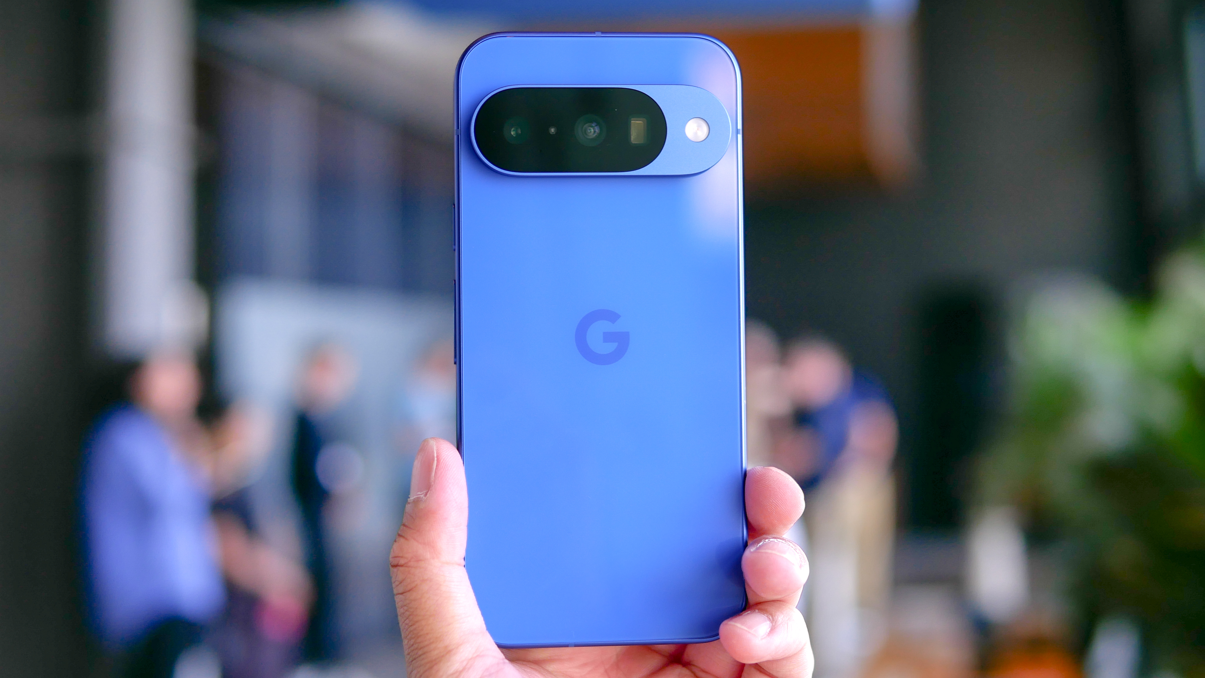 Google Pixel 10 held in the hand.