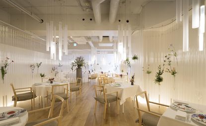 light, white and floral themed restaurant dining room