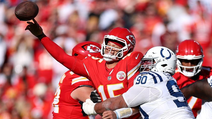 The Kansas City Chiefs&#039; Patrick Mahomes throwing the ball under pressure from the Indianapolis Colts&#039; Grover Stewart