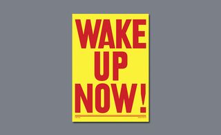 Yellow poster with red font reading 'WAKE UP NOW!'