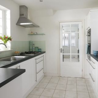 White kitchen with black countertops