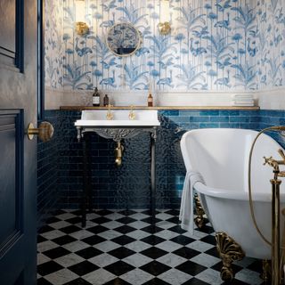 Blue bathroom with wallpaper with panelling