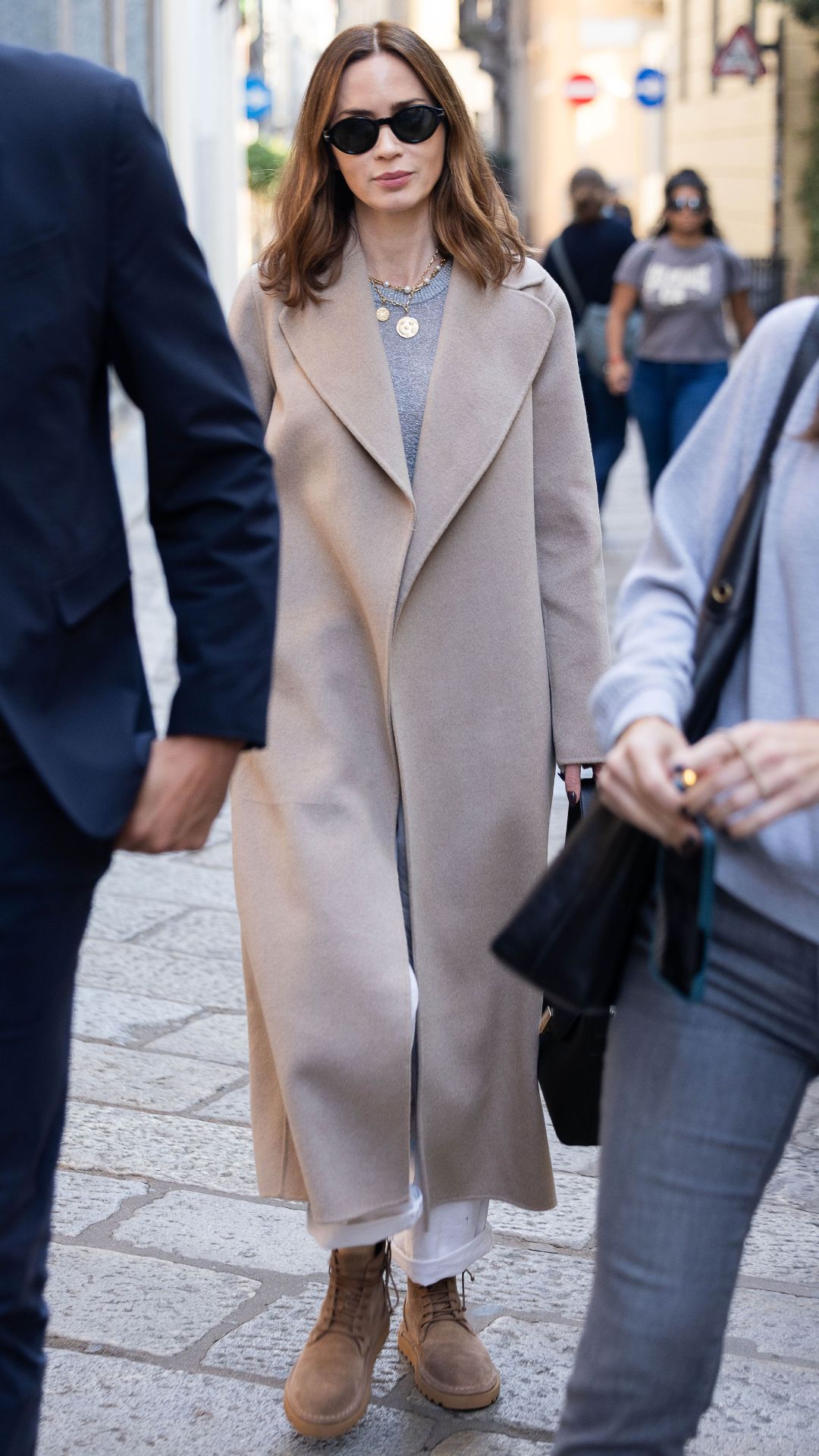 Emily Blunt wearing cosy-chic outfit formula on October 08, 2025 in Milan, Italy