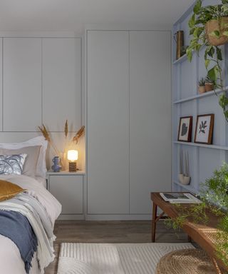 grey bedroom with built in wardrobes and floating shelves