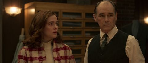 Zoey Deutch and Mark Rylance share a moment of concern in the tailor shop in The Outfit.