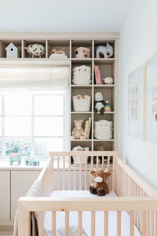 A small nursery with storage along the wall